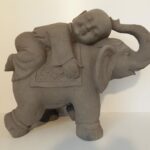 Monnik op Olifant...  Hoogte 57 cm.